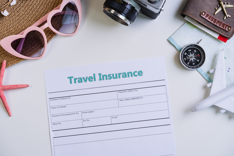 Holiday Insurance form with travel accessories